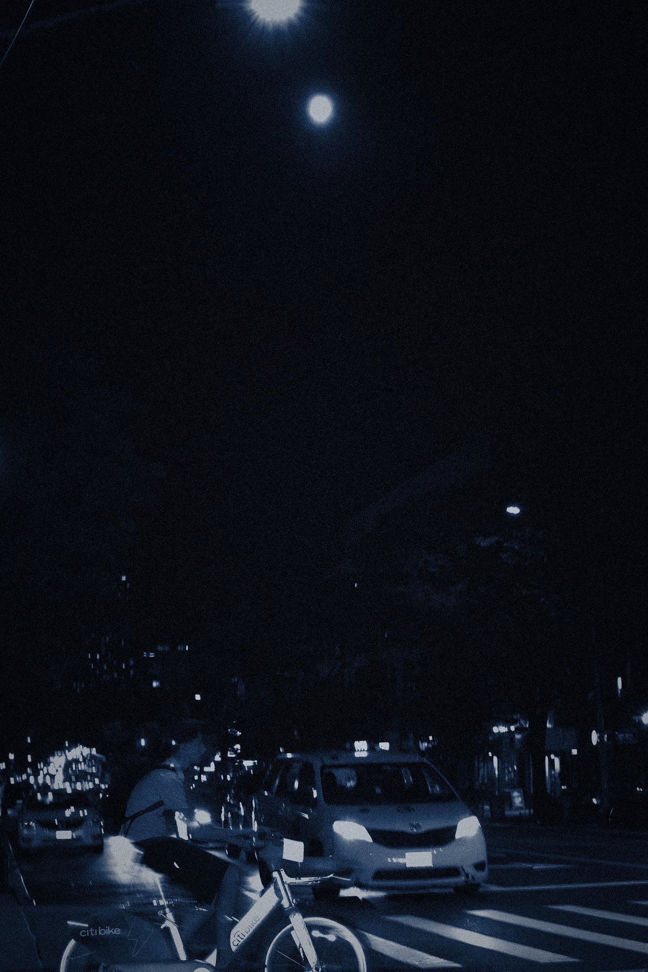 3:49 AM. The moon, a cab, a bicycle.