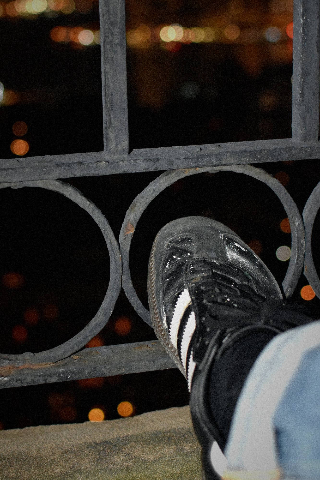 4:47 AM. One shoe, a railing, the whole city.